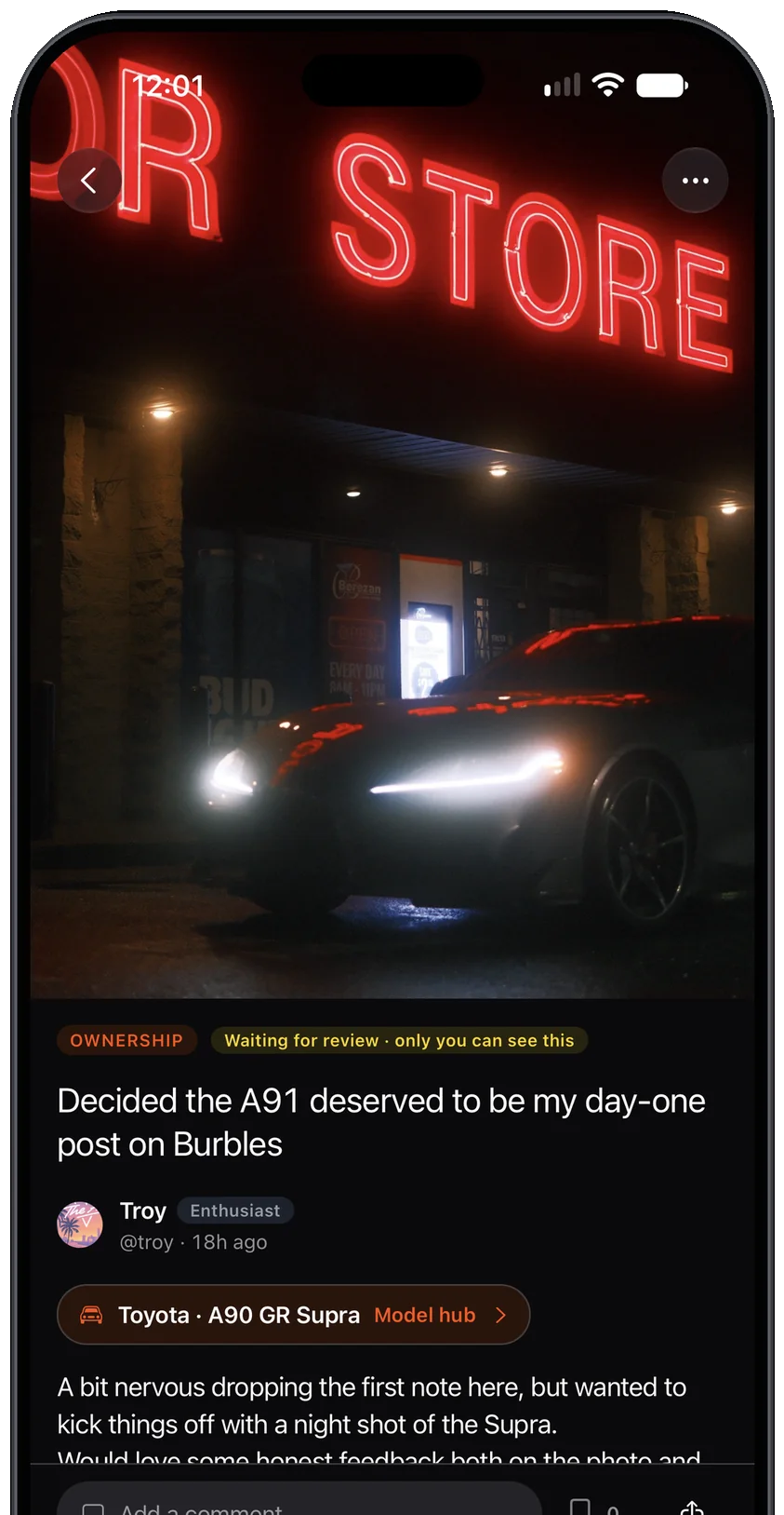 A Community post in the app: a GR Supra at night under a neon sign, with nods and replies