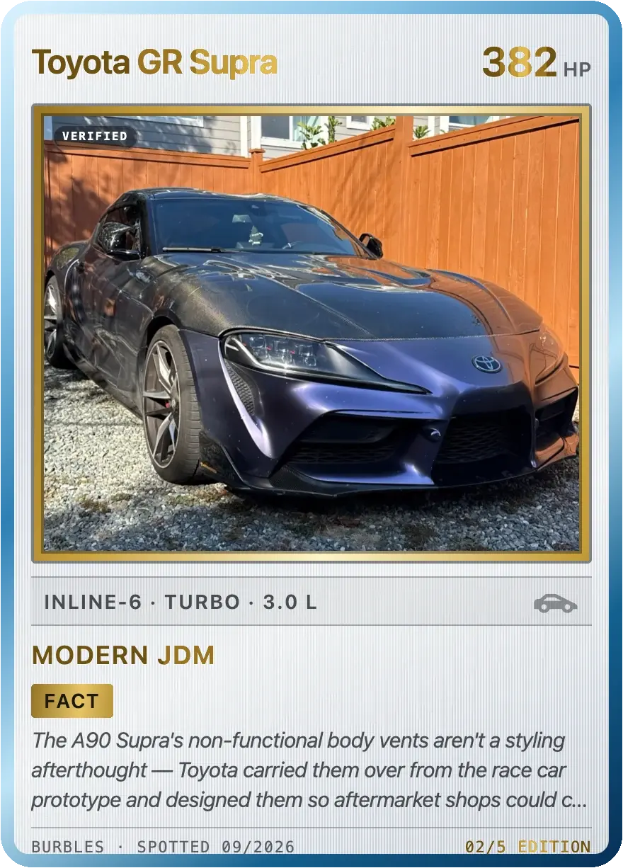 The front of a member's card in the Gold Stamp finish: Toyota GR Supra, 382 hp, inline-six turbo, 3.0 litres, Verified, the Modern JDM set, and a fact about its body vents